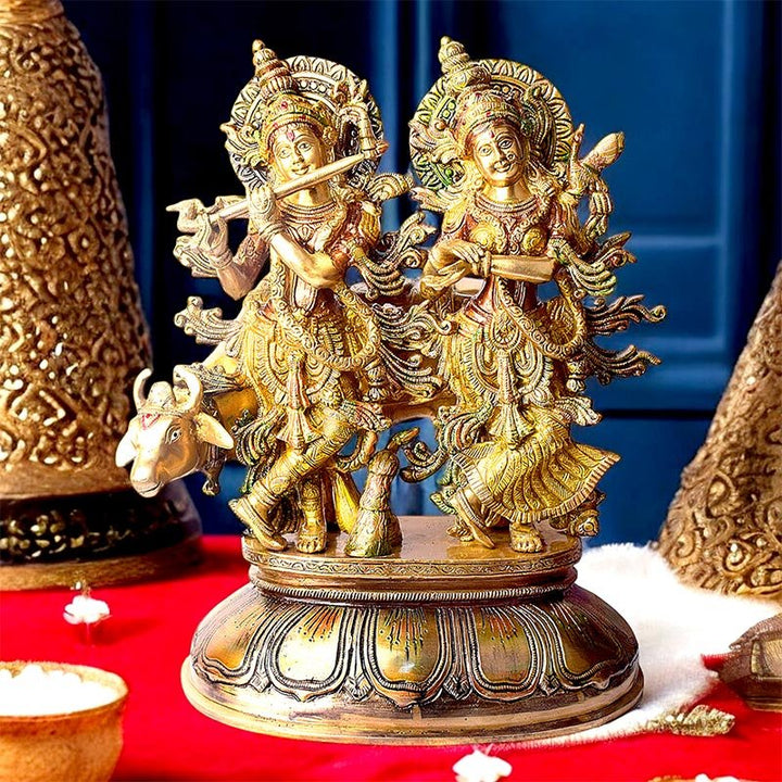 16 Inches Charming Radha Krishna with Kamdhenu Colorful Brass Idol – A vibrant and intricate brass idol of Radha Krishna with Kamdhenu, capturing the essence of divine love and prosperity. Ideal for spiritual décor and worship. India’s Largest Pooja Accessories Brand – www.satvikworld.com