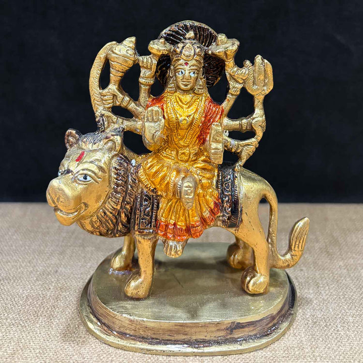 4.1-inch stunning Sherawali Mata idol, beautifully crafted in brass with intricate detailing, depicting the goddess seated on a lion, symbolizing strength, protection, and divine grace. Ideal for home or temple décor. India’s Largest Pooja Accessories Brand – www.satvikworld.com