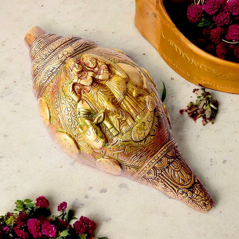 Brass Shankh with Divine Carvings of Radha Krishna – A Beautifully Crafted Shankh with Intricate Carvings of Lord Radha Krishna, Symbolizing Spiritual Blessings and Divine Harmony. This Sacred Brass Shankh is Ideal for Worship, Spiritual Practices, and Home Temple Décor. India’s Largest Pooja Accessories Brand – www.satvikworld.com