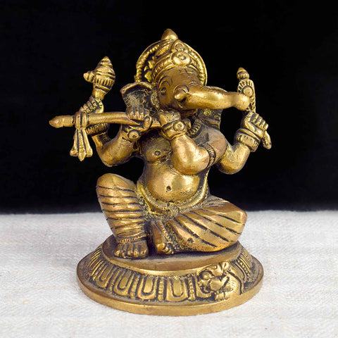3.1-inch divine Ganesha statue crafted in brass, uniquely depicting Lord Ganesha playing a flute, symbolizing creativity, wisdom, and musical grace. Perfect for spiritual décor or puja space. India’s Largest Pooja Accessories Brand – www.satvikworld.com