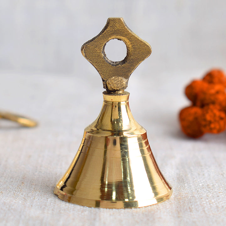 Elegant brass pooja bell emitting a soothing, melodic sound, ideal for enhancing spiritual rituals and invoking divine blessings. India’s Largest Pooja Accessories Brand – www.satvikworld.com
