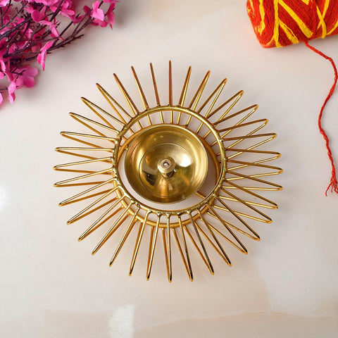 Gold-toned decorative Akhand Sun Shape Brass Diya, elegantly designed with intricate detailing, perfect for enhancing the spiritual ambiance of your pooja space with continuous, radiant light. India’s Largest Pooja Accessories Brand – www.satvikworld.com