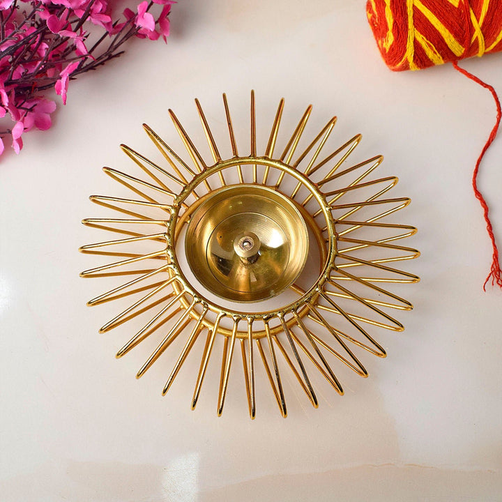 Gold-toned decorative Akhand Sun Shape Brass Diya, elegantly designed with intricate detailing, perfect for enhancing the spiritual ambiance of your pooja space with continuous, radiant light. India’s Largest Pooja Accessories Brand – www.satvikworld.com