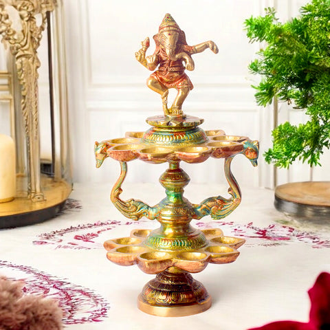 Handcrafted Brass 21 Wick Ganesha Diya – 2 Step Aarti Lamp, a stunning and intricate diya designed for vibrant aarti rituals, featuring 21 wicks and a detailed Ganesha design. India’s Largest Pooja Accessories Brand – www.satvikworld.com