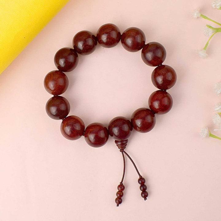 Original 13 Beads Red Chandan Bracelet made from 18mm sandalwood beads of Andhra Pradesh. India’s Largest Pooja Accessories Brand - www.satvikworld.com