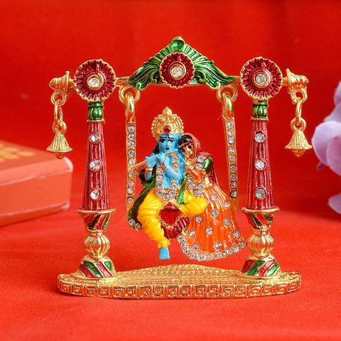 Beautiful Radha Krishna Idol seated on a decorative swing, symbolizing divine love and perfect for home temple or gifting. India’s Largest Pooja Accessories Brand – www.satvikworld.com