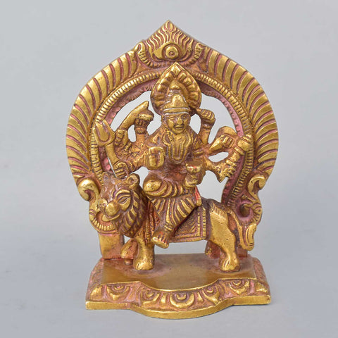 3.3-inch Sherawali Mata idol elegantly encased in a golden frame, featuring the goddess seated on a lion with intricate detailing, vibrant colors, and traditional ornaments—radiating grace and divine protection, perfect for car dashboards or home altars. India’s Largest Pooja Accessories Brand- www.satvikworld.com