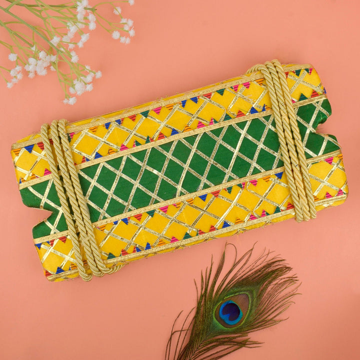 yellow and green decorative Jhula for Hariyali Teej, designed for Lord Krishna idol with festive floral detailing. India’s Largest Pooja Accessories Brand – www.satvikworld.com