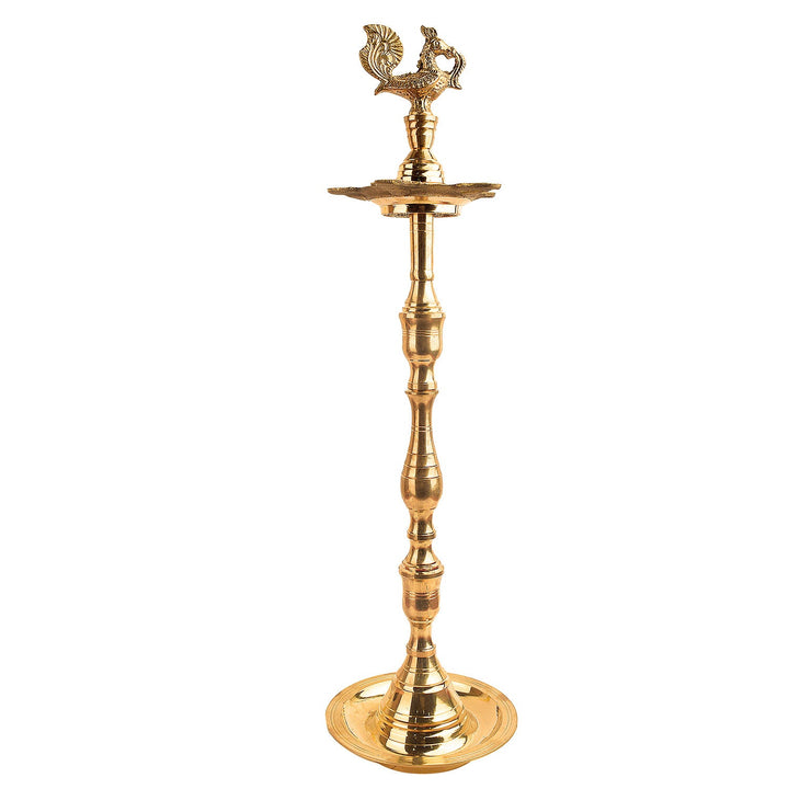 19 Inch Brass Peacock Kerala Diya – Majestic brass diya with an intricate peacock design, ideal for pooja ceremonies, spiritual rituals, and home decor. India’s Largest Pooja Accessories Brand – www.satvikstore.in