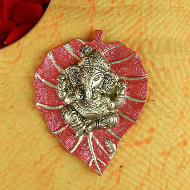 Red Lord Ganesh on Leaf Patta Wall Hanging – Beautiful and vibrant spiritual wall art for home and temple.
India’s Largest Pooja Accessories Brand – www.satvikworld.com