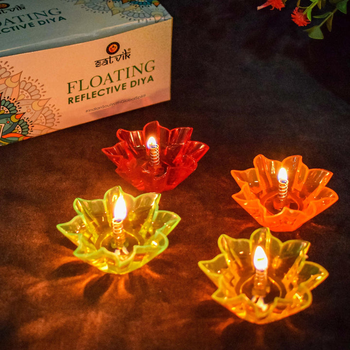Set of 12 reflective floating Diwali diyas in vibrant multicolor designs, perfect for enhancing festive décor with shimmering light on water surfaces. India’s Largest Pooja Accessories Brand – www.satvikworld.com