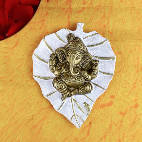 White Lord Ganesh on Leaf Patta Wall Hanging – Elegant and peaceful wall decor for pooja room or home. India’s Largest Pooja Accessories Brand – www.satvikworld.com