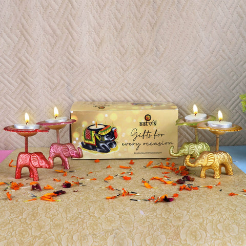 Assorted set of 4 metal elephant diya showpieces, each uniquely handcrafted with intricate detailing, holding decorative diyas—perfect for festive décor and spiritual ambiance. India’s Largest Pooja Accessories Brand – www.satvikworld.com