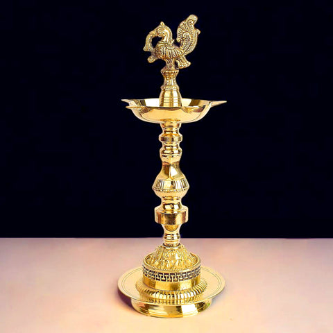 12 inch embossed peacock Kerala stand diya, 1 step traditional brass Nilavilakku for pooja, temple rituals, and festive decor. India’s Largest Pooja Accessories Brand – www.satvikworld.com