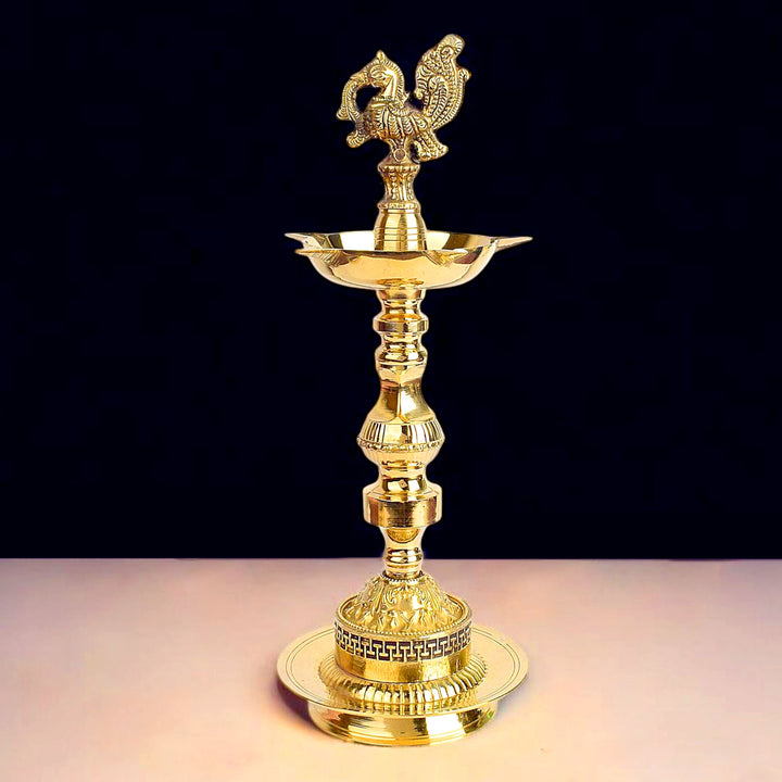 12 inch embossed peacock Kerala stand diya, 1 step traditional brass Nilavilakku for pooja, temple rituals, and festive decor. India’s Largest Pooja Accessories Brand – www.satvikworld.com