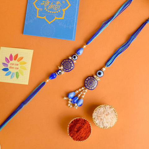 Designer Couple Rakhi Set for Bhaiya and Bhabhi with Roli Chawal and Ram Sita Stickers – Raksha Bandhan Gift Combo. India’s Largest Brass Idols Brand - www.satvikworld.com