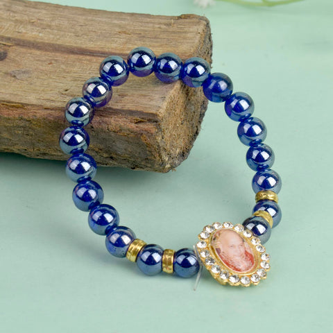 Dark Blue Shiny Beads Single Layer Guruji Swaroop Bracelet featuring shimmering dark blue beads and Jai Guruji Swaroop – perfect for minimalist spiritual wear, meditation, and gifting. India’s Largest Pooja Accessories Brand – www.satvikworld.com