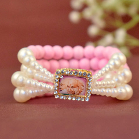 Pink & White Pearl Four Layer Guruji Swaroop Bracelet featuring delicate pink beads and luminous white pearls with Jai Guruji Swaroop – perfect for spiritual wear, festive gifting, and daily devotion. India’s Largest Pooja Accessories Brand – www.satvikworld.com
