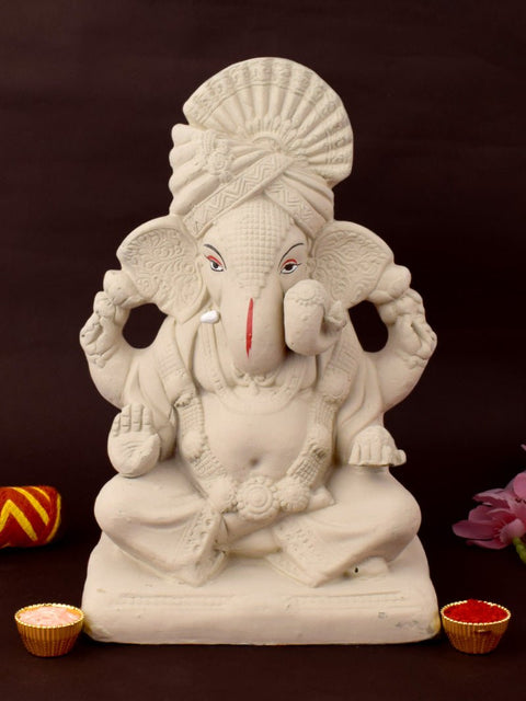 10.5 Inch Sarvadevatman Ganpati idol adorned with traditional Pagdi, eco-friendly craftsmanship in sitting posture with intricate detailing and natural clay finish. India’s Largest Pooja Accessories Brand – www.satvikworld.com