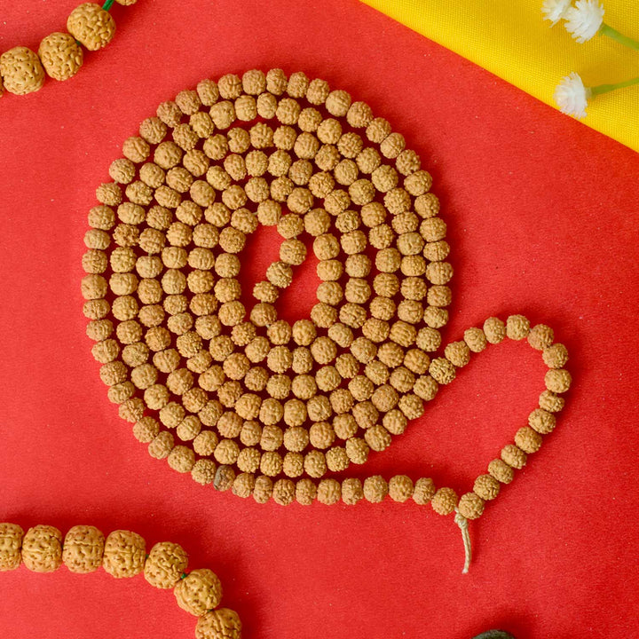 Semi Pathariya Rudraksha Mala with natural brown beads for meditation and spiritual chanting. India’s Premium Rudraksha Jap Mala Store- www.satvikworld.com
