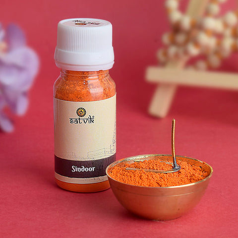 Bright red Sindoor powder in a container, traditionally used for worship of Hanuman Ji in Hindu rituals.India’s Largest Pooja Accessories Brand – www.satvikworld.com