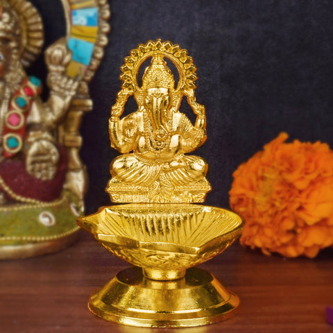 1 Pc Lord Ganesha Metal Diya – A beautifully crafted metal diya featuring Lord Ganesha, perfect for spiritual rituals and home decor during festivals or daily prayers. India’s Largest Pooja Accessories Brand – www.satvikworld.com