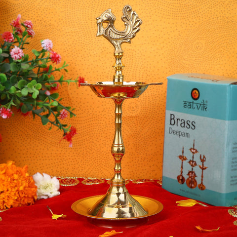 6.5 Inch Brass Peacock Kerala Diya – Traditional and graceful brass diya with a peacock design, perfect for pooja ceremonies, spiritual rituals, and home decoration. India’s Largest Pooja Accessories Brand – www.satvikstore.in
