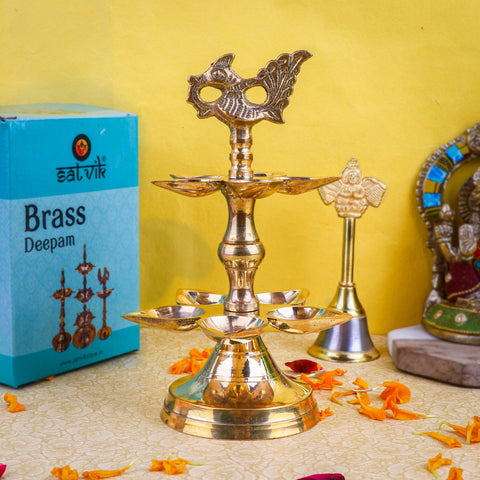 Brass 2 Step Panchmukhi Peacock Kerala Diya – Elegant two-tier brass diya with five-mouthed holders and a peacock top, ideal for pooja and traditional ceremonies. India’s Largest Pooja Accessories Brand – www.satvikstore.in