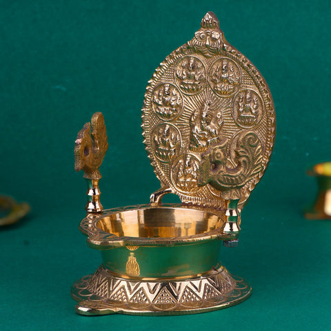 Engraved Brass Ashtalaxmi Diya, showcasing intricate engravings of the eight forms of Goddess Lakshmi, designed to bring prosperity and divine blessings to your home or temple. India’s Largest Pooja Accessories Brand – www.satvikworld.com
