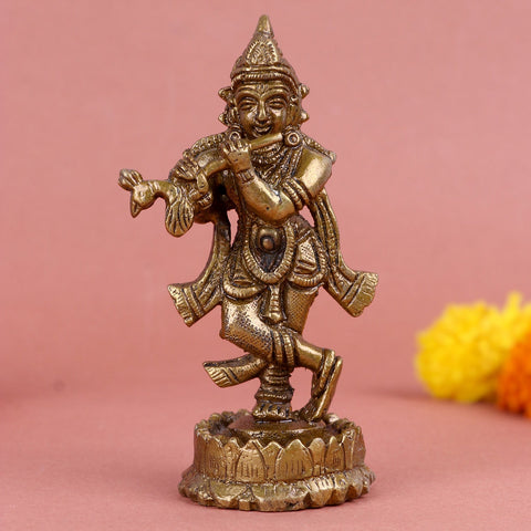 Brass Krishna idol, beautifully crafted with intricate details, depicting Lord Krishna playing the flute, symbolizing divine music, grace, and devotion. Ideal for worship or spiritual décor. India’s Largest Pooja Accessories Brand – www.satvikworld.com