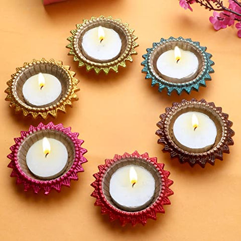 Exquisite Decorative Multicolor Surya Metal Diya – A vibrant metal diya featuring a radiant Surya (Sun) motif in multicolor design, perfect for pooja, Diwali decor, and enhancing spiritual ambiance at home. India’s Largest Pooja Accessories Brand – www.satvikworld.com