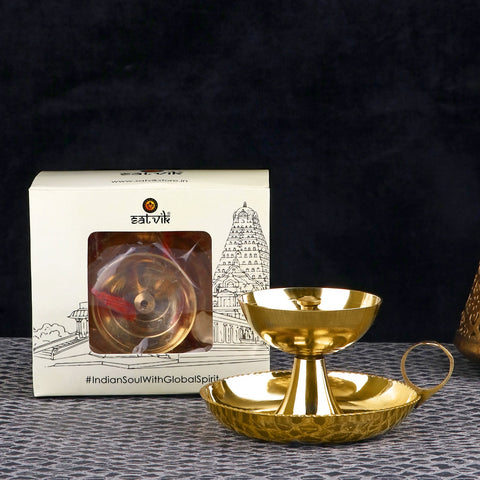 Pure Brass Aarti Akhand Diya with Ring Holder – Traditional handcrafted brass diya featuring a protective chimney and sturdy ring holder, perfect for safe and uninterrupted aarti rituals. India’s Largest Pooja Accessories Brand – www.satvikworld.com